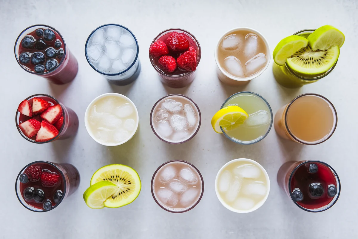 Different portion sizes of a healthy fruit drink in small cups.